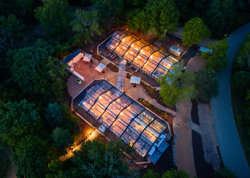 The woodland glasshaus at Bavaria Downs The Woodland Glasshaus shot on drone at night by Tim Thornburg Films Minnesota Wedding Videographer Bavaria Downs