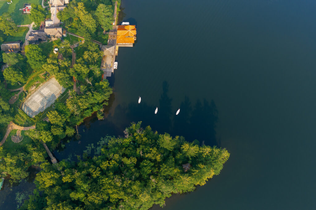 Stout's island Lodge in the morning from drone perspective. You can see the aged tennis courts from this angle.